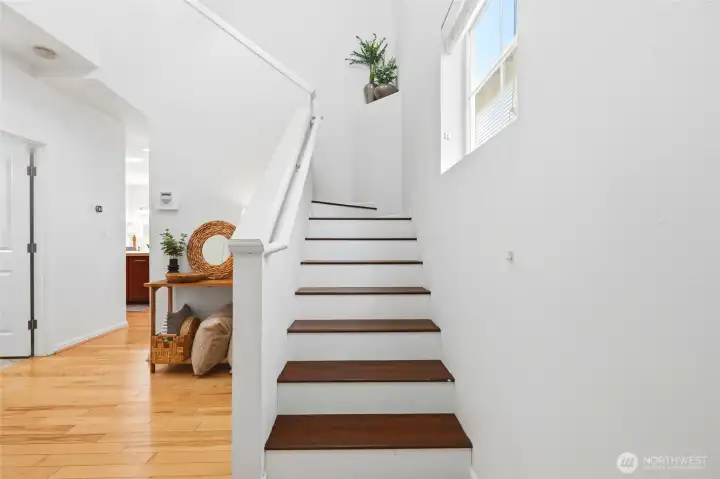 Staircase & Entry Light-filled entry showcasing a modern staircase, large window, and open design that enhances the home's airy and inviting atmosphere. Staircase & Entry Light-filled entry showcasing a modern staircase, large window, and open design that enhances the home's airy and inviting atmosphere.