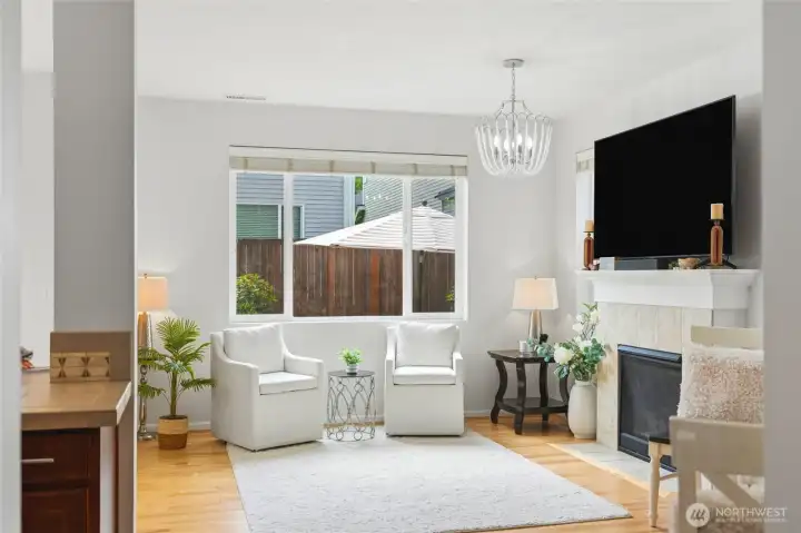 Sitting Area & Fireplace Inviting gathering space with large picture windows, elegant fireplace, and a comfortable seating area perfect for relaxing or entertaining. Sitting Area & Fireplace Inviting gathering space with large picture windows, elegant fireplace, and a comfortable seating area perfect for relaxing or entertaining.