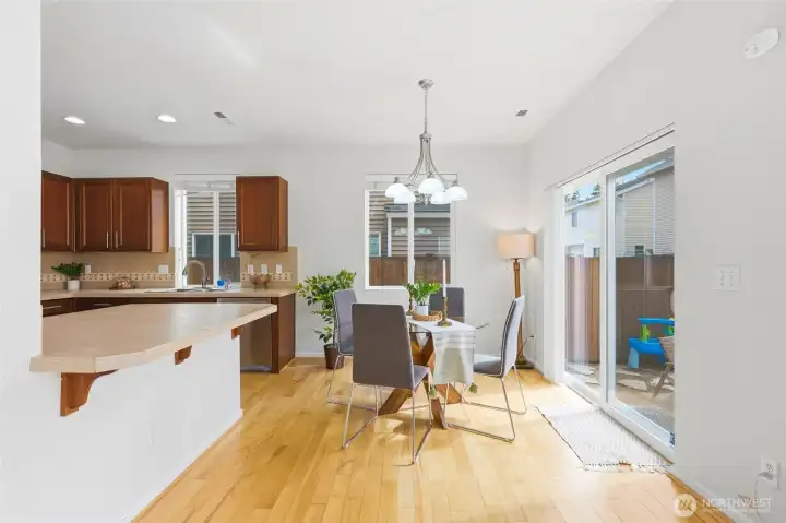 Dining Area Bright and inviting dining area with hardwood floors, large sliding glass doors to the patio, and abundant natural light. Conveniently located adjacent to the kitchen, creating an ideal space for everyday dining and effortless indoor-outdoor entertaining. Dining Area Bright and inviting dining area with hardwood floors, large sliding glass doors to the patio, and abundant natural light. Conveniently located adjacent to the kitchen, creating an ideal space for everyday dining and effortless indoor-outdoor entertaining.
