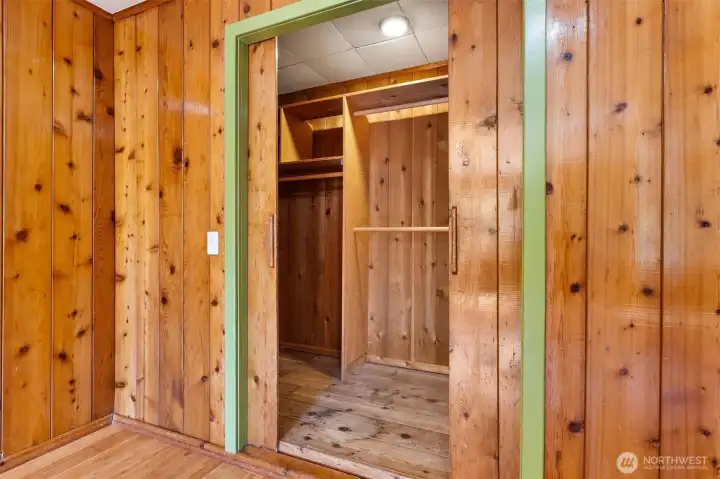The closet is cedar lined and extra deep with shelves.