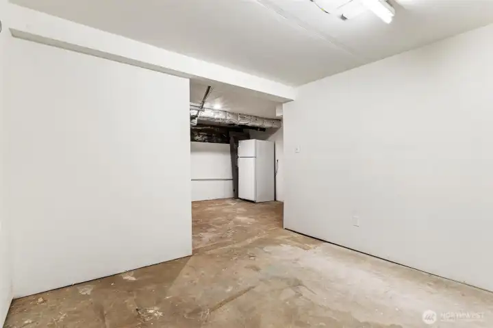 Perfect hobby/shop room with storage, power and finished walls.