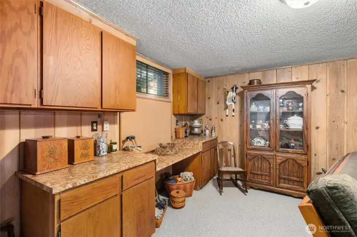 The lower family room has so much character and you can have those chilly Seattle nights in front of your wood burning fireplace.