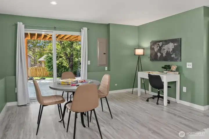 The lower level also offers a bright and flexible dining or workspace area with large windows framing colorful outdoor greenery, ideal for a home office setup or casual dining. The lower level also offers a bright and flexible dining or workspace area with large windows framing colorful outdoor greenery, ideal for a home office setup or casual dining.