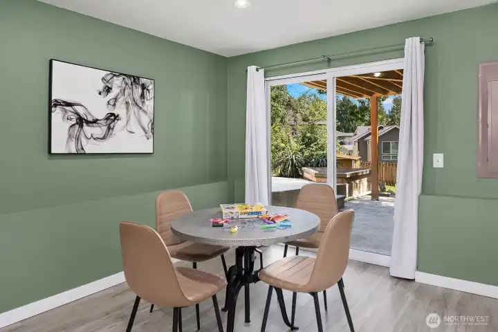 A closer view of this versatile lower level space highlights the sliding door to the backyard, creating a seamless indoor-outdoor connection perfect for everyday living or working from home. A closer view of this versatile lower level space highlights the sliding door to the backyard, creating a seamless indoor-outdoor connection perfect for everyday living or working from home.