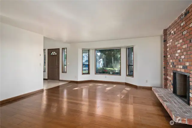 Beautiful engineered hardwood floors throughout main living area. Gorgeous bay window gathers plenty of natural light into this spacious living area.