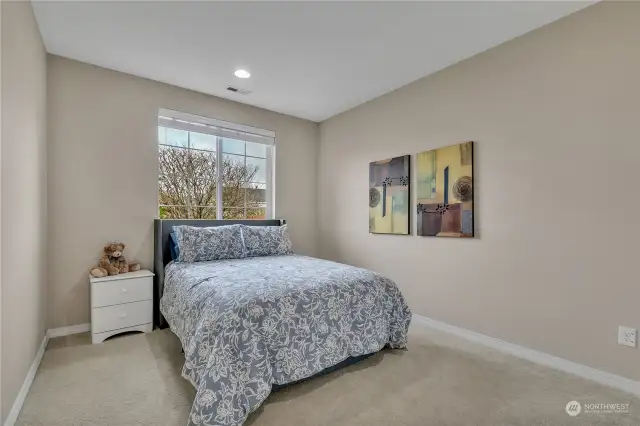 Guest room or office facing the front of the home, separated for privacy