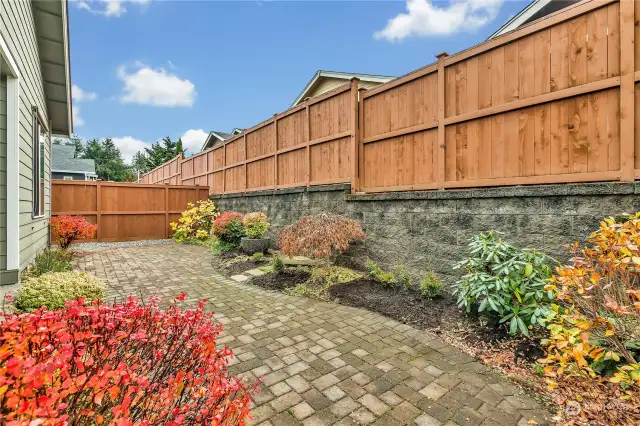 Retaining wall raises up fence giving nice privacy to the backyard patio