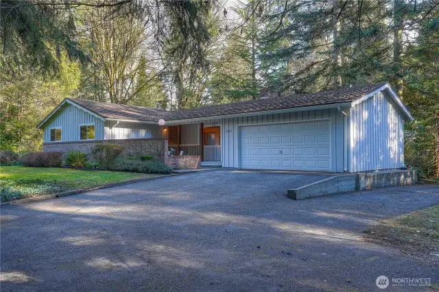 Perfectly sited on a shy 1/2 acre lot, this lovingly maintained mid-century modern gem is ready for you to call it home!!