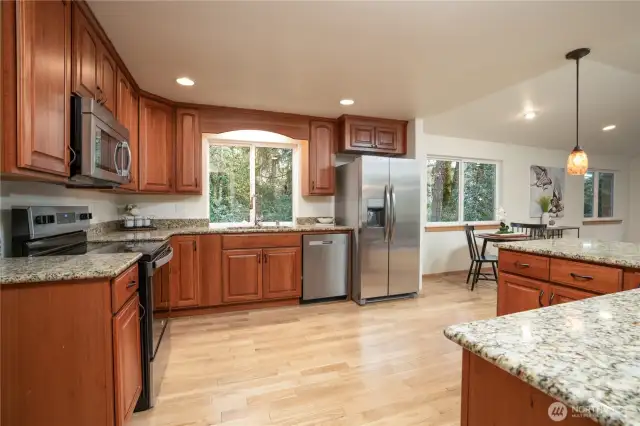 Spacious kitchen with granite countertops, engineered hardwood floors & Stainless Steel appliances (range & fridge are brand new) that flows into the great room addition.