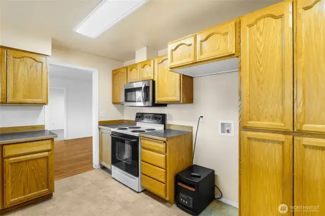 Another view of the large kitchen. The microwave and stove/range come with the house.