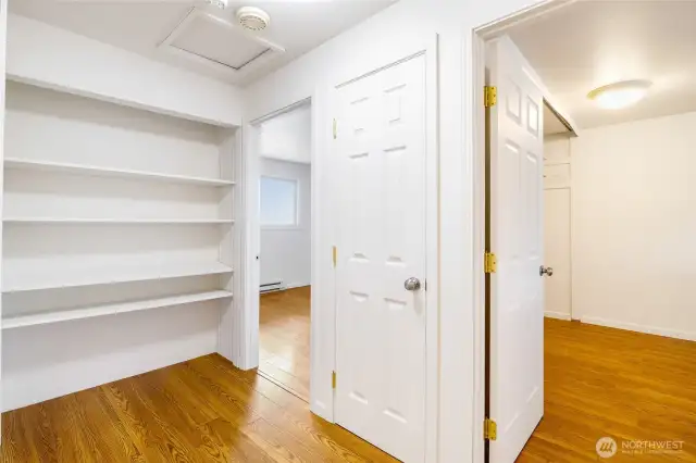 Between the bedrooms is an amazing shelving system for games, toys, books, you name it!