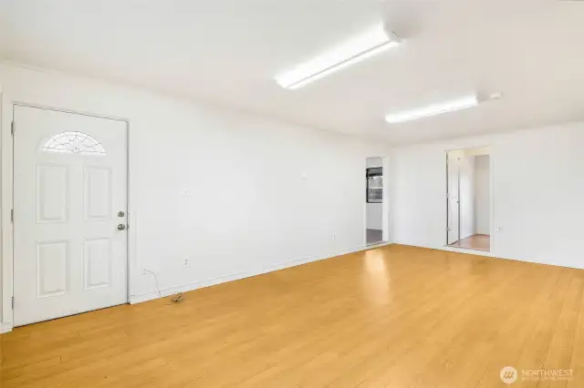 The family room is such a wonderful room away from the living room. This is on the far right side of the house and has an office (or 4th bedroom) that faces the backyard. The open door to the left is the entry into the dining room.