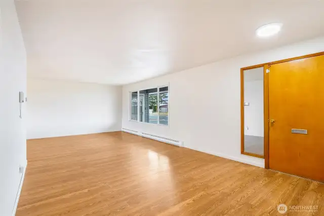The living room is quite large, and the wooden living room door is heavy duty.