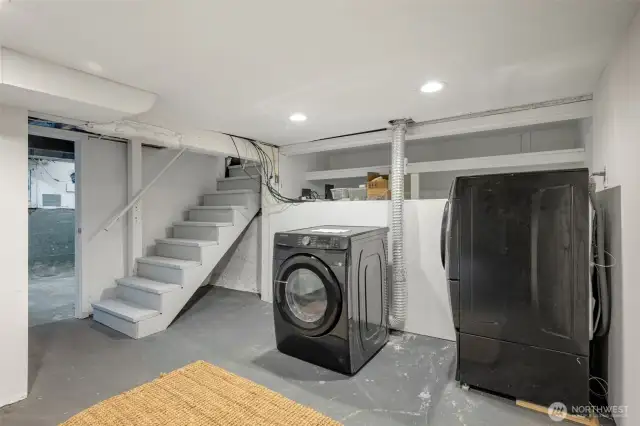 Lower level- laundry room and just through the door on the left is the basement. One more floor down are stairs to the one-car garage.
