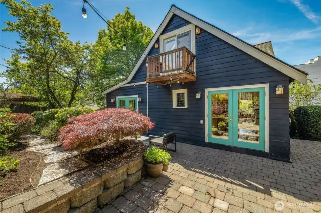 The brick patio wraps around to the north side of the home which has a gate.