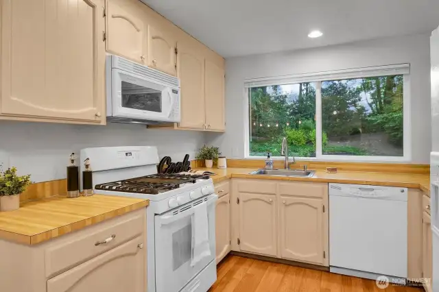 Well-designed U-shaped kitchen featuring ample counter space for meal preparation and entertaining.