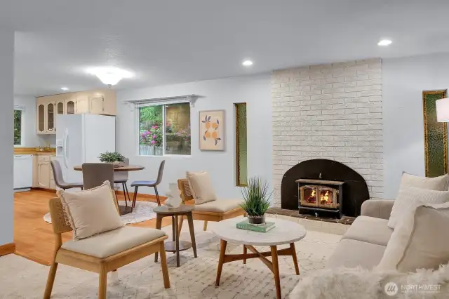 Inviting family room featuring a warm and cozy wood-burning fireplace.