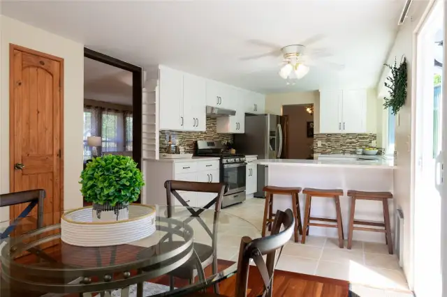 Added rustic charm and warmth with beautiful custom knotty pine doors throughout the home.
