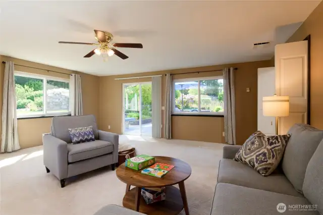 Enjoy extra space with a massive bonus room—ideal for a home office, media/game room, or guest area. Lots of windows and soft carpet underfoot creates a cozy and inviting space. The slider leads out to the back deck and yard.