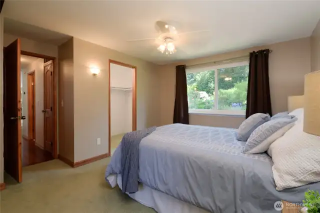 The primary suite is easily spacious enough for this Queen sized bed and easily has room to spare for a King bed. The Suite enjoys a spacious walk-in closet and private 3/4 bath.