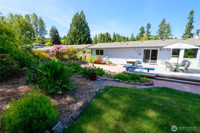 Step into your own backyard oasis—whether you're sipping coffee on the patio, playing catch on the lawn, or enjoying the shade of mature fruit trees, this outdoor space is designed for both relaxation and recreation. With over half an acre to explore, there's ample room for gardening, entertaining, or simply unwinding in peace. It's the perfect blend of serenity and function for those who love spending time outdoors.