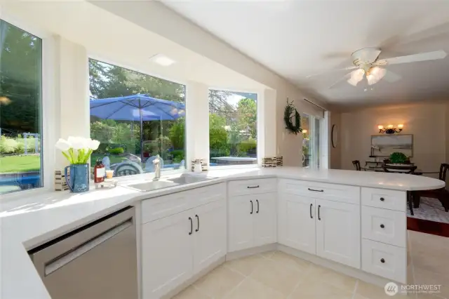 The Stainless Steel appliances have all been updated. Whether you’re cooking, entertaining, or simply enjoying your morning coffee, the large windows and seamless sightlines create a bright, airy atmosphere that connects indoor living with the tranquil outdoor retreat just steps away.