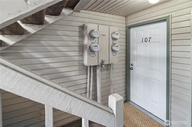 Down a half flight of stairs to a private & quiet side of the condominium complex