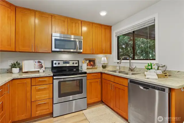 Updated Kitchen with stainless steel appliances and granite counters