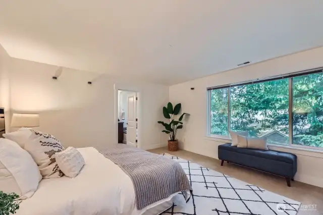 Main primary suite on 2nd floor with 5 pc bath including soaking tub and dual vanity. Walk-in closet with custom shelving.