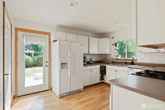 Kitchen w/gas stove and door leading to nice deck and spacious backyard