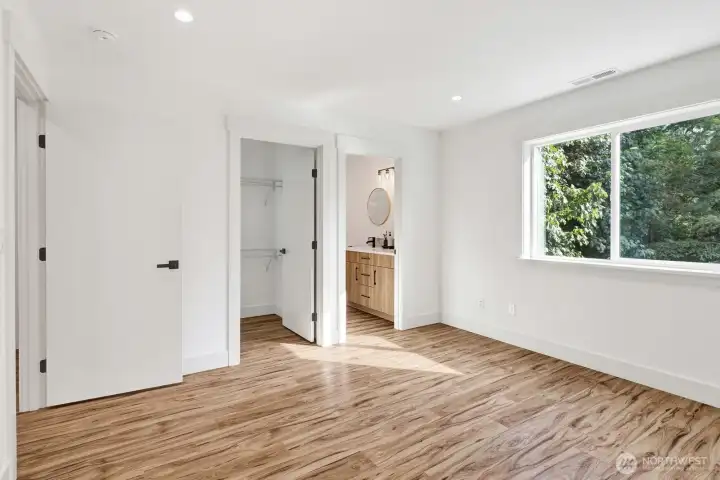 Owner's suite features a well appointed bath with dual sink and Walk in Closet