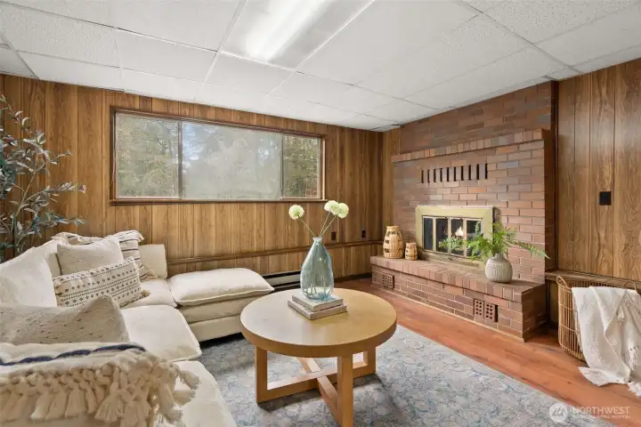 Spacious family room with fireplace on lower level.