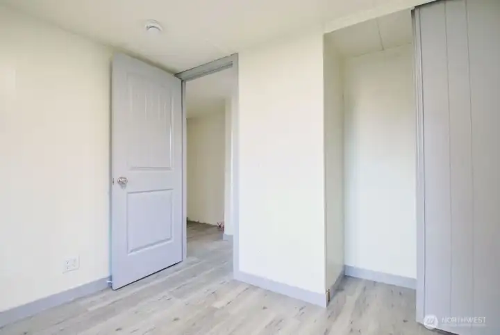 View from bedroom looking towards the hallway. View of closet.