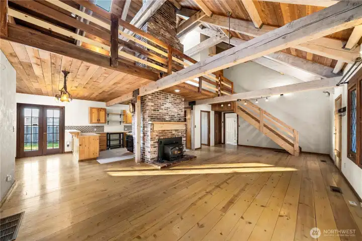 Doorway under stairs to additional bedrooms and basement