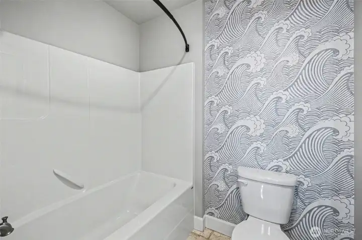 Full bath features private water closet with shower and toilet.