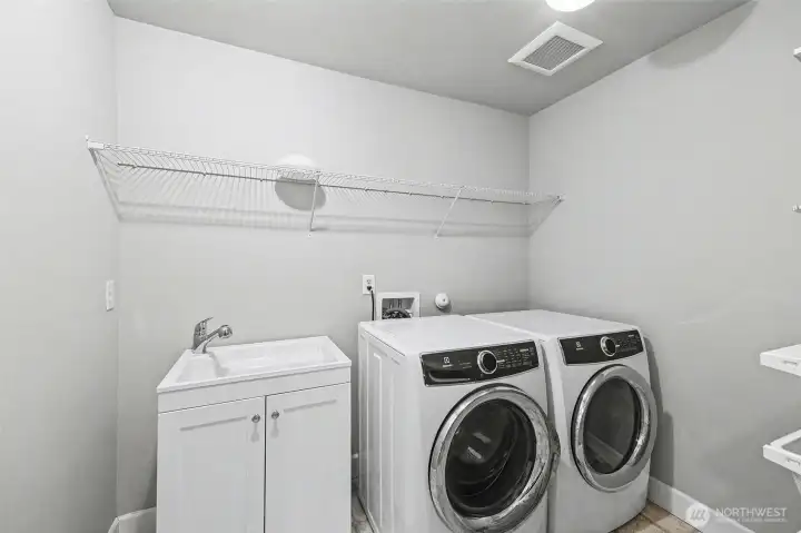 Conveniently located on the second floor is your laundry room with tons of storage space, and handwash sink.