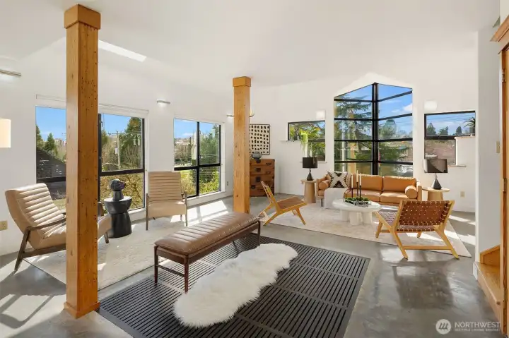 Open-plan great room integrates living, dining & kitchen