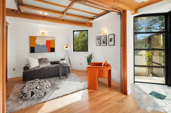 Salon space with warm wood accents and seamless indoor-outdoor connection