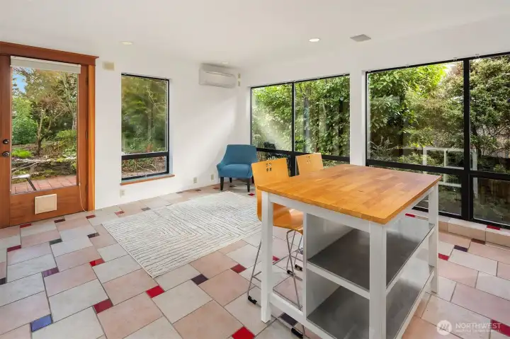 Sunlit apartment space with tranquil green views