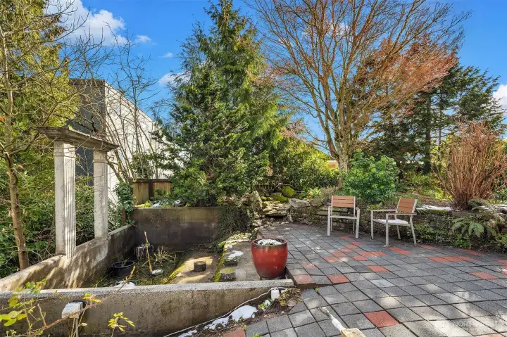 Tranquil garden with reflective water feature—your own private retreat