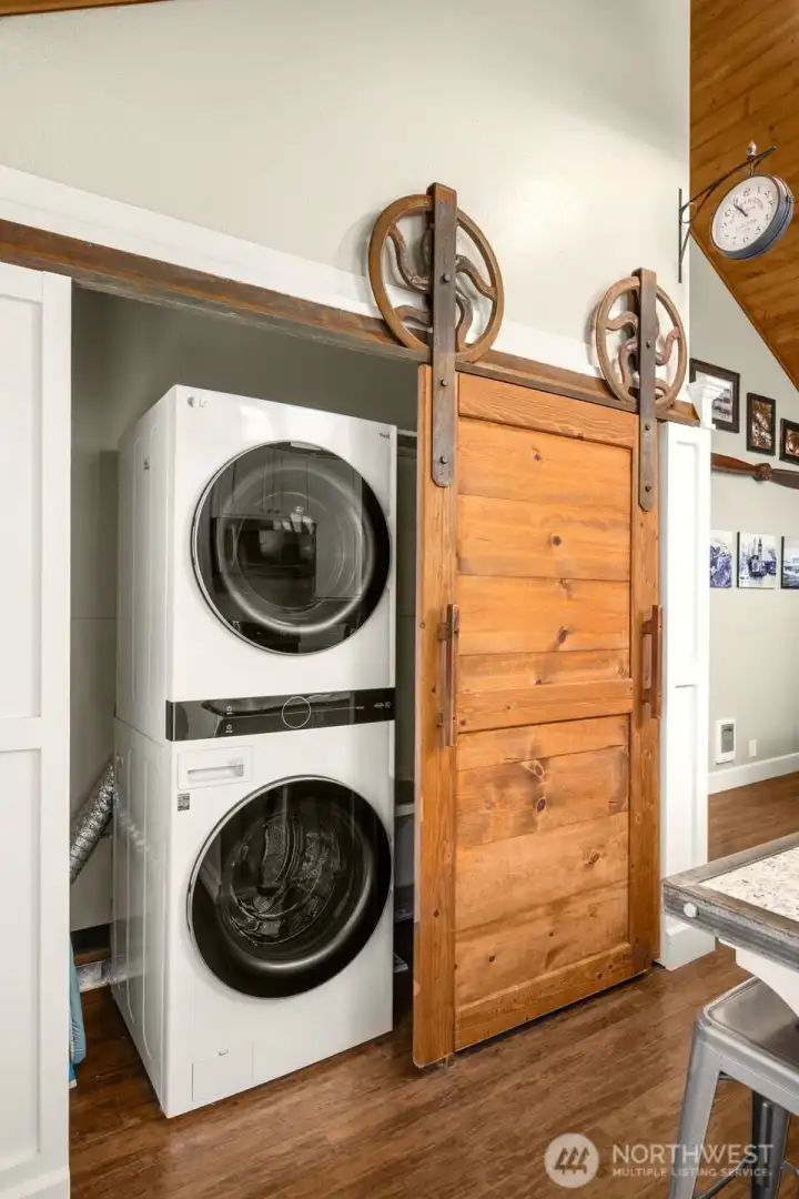 Laundry room w/storage area & tankless water heater