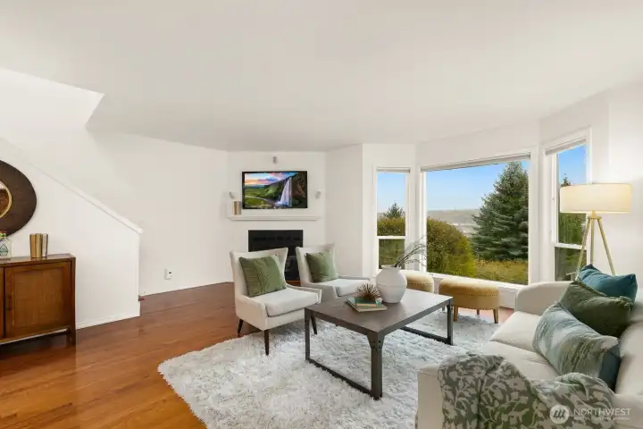 The living room is bright and spacious with lovely morning light