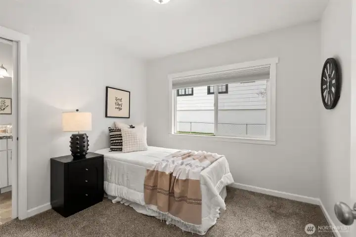 Bedroom 2: main floor with pocket door to main bathroom