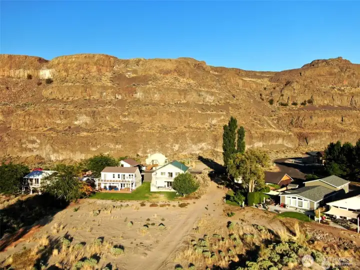 Aerial view of home, grass yard and the sandy beach path to the river in front of the house! Best beach in Sunland