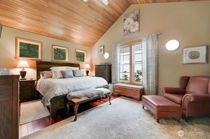 Warm and spacious primary bedroom with warm finishes