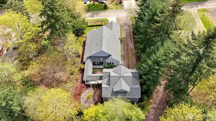 Covered breezeway to detached garage and bonus space.