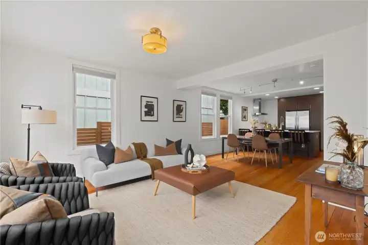 Step into the light filled living room that opens to kitchen