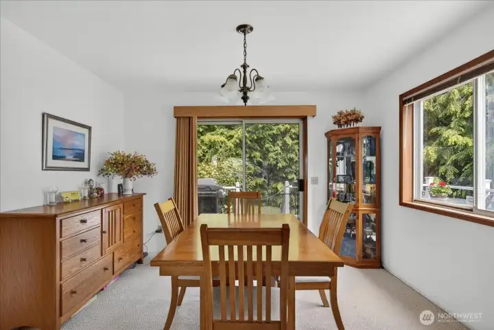 Dining room with access to the deck and backyard.