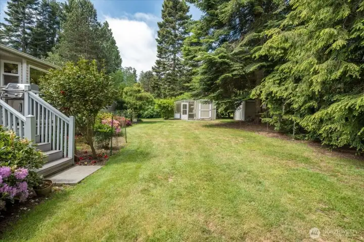 Beautifully maintained backyard with mature landscaping.