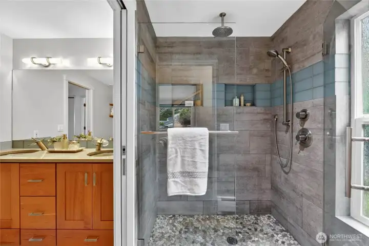 Photos of the shower shared with the hall bath and primary bath. So unique.